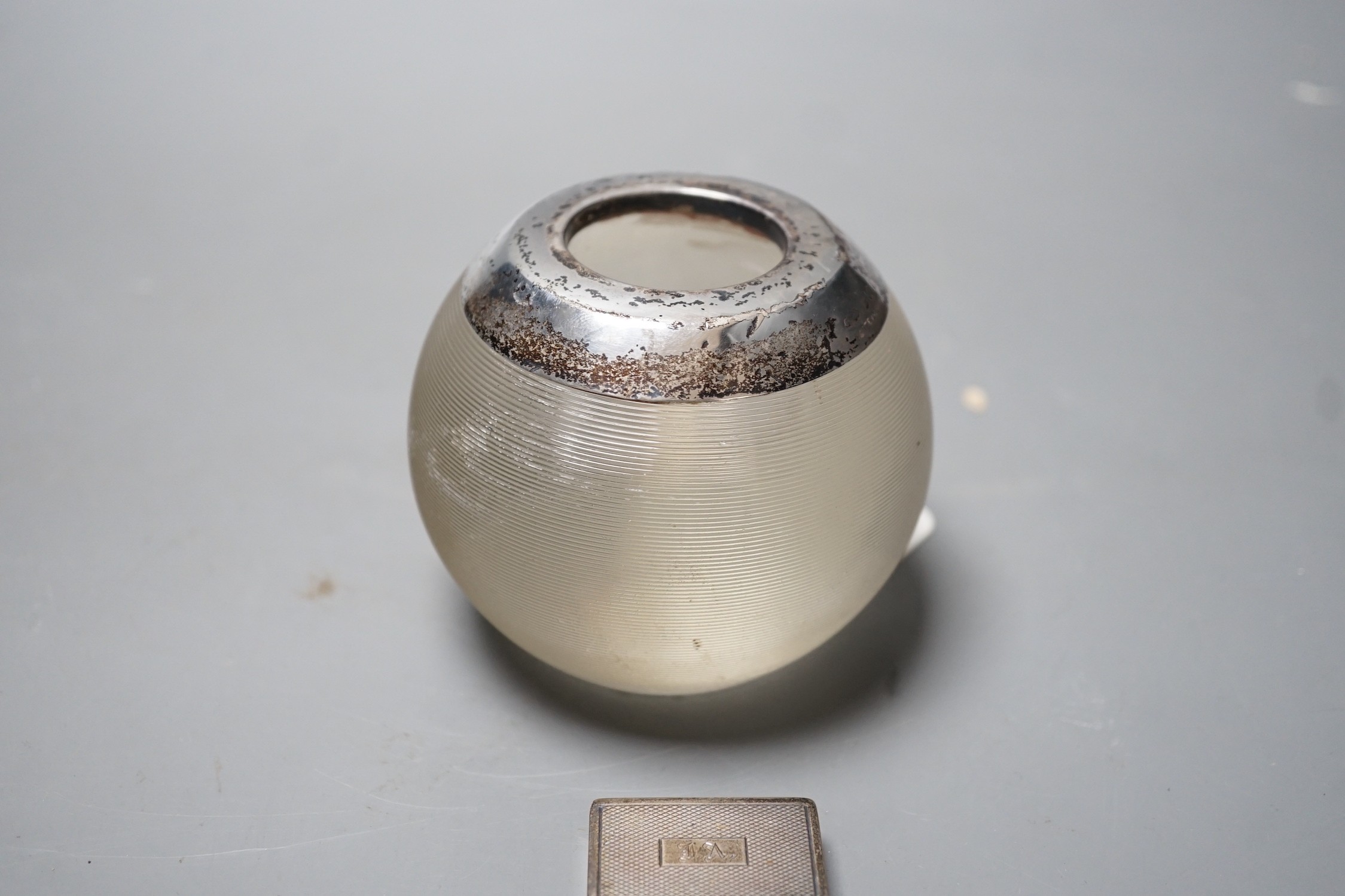 A George V silver mounted ribbed glass match strike, height 75mm and a late Victorian silver pill box.
